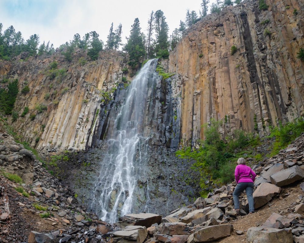 Woman Looking at Palisade Falls in Hyalite Recreation Area
