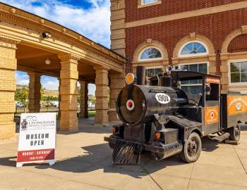 A historic train car outside the Livingston Depot Museum in Livingston, Montana