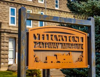 An orange sign that reads Yellowstone Gateway Museum at the Yellowstone Gateway Museum in Livingston