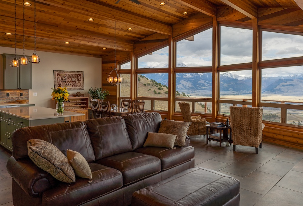 Vacation rental home interior with large picture windows and expansive mountain views