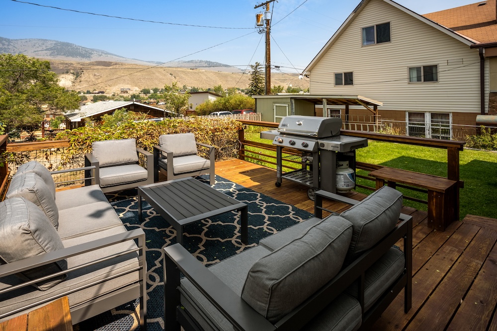Vacation rental exterior with deck and outdoor seating