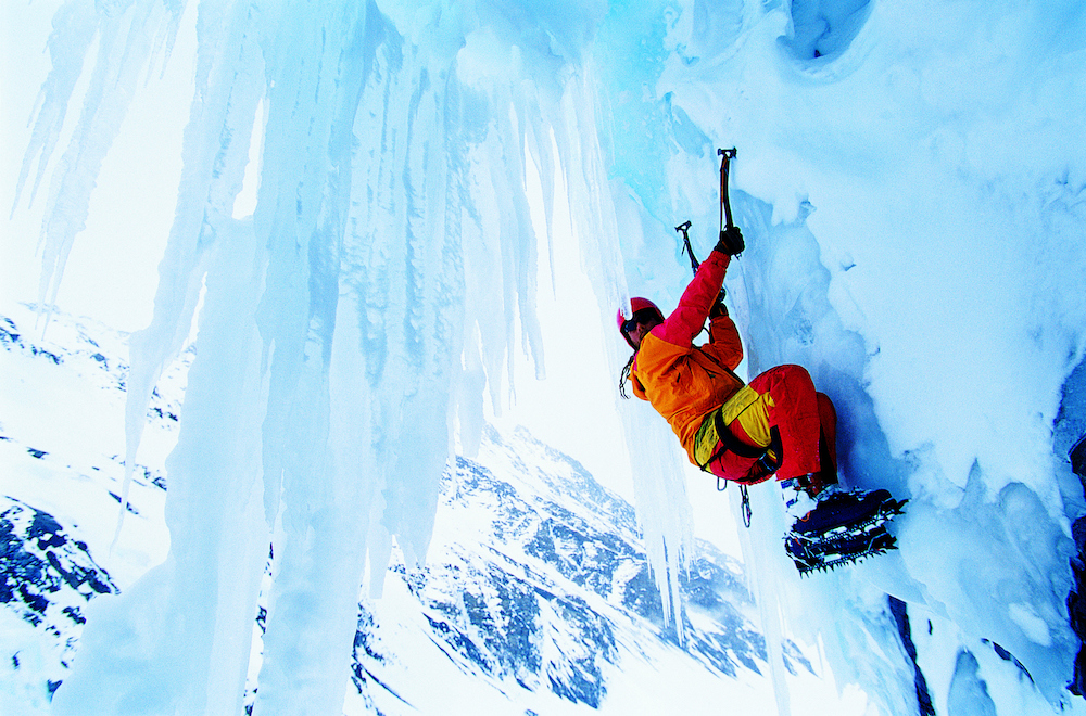 person ice climbing