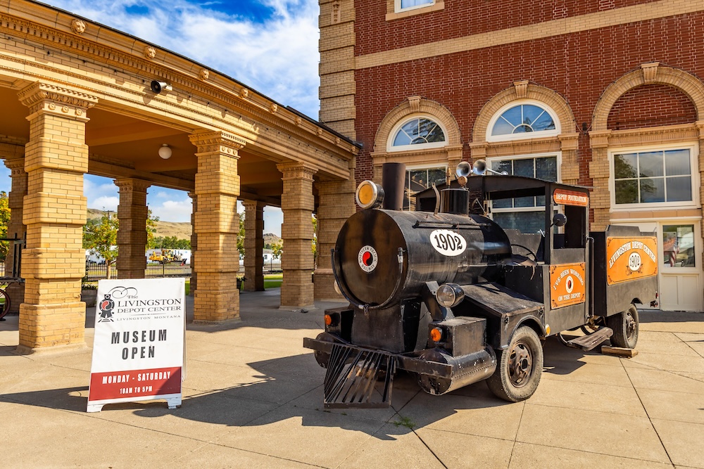 A historic train car outside the Livingston Depot Museum in Livingston, Montana