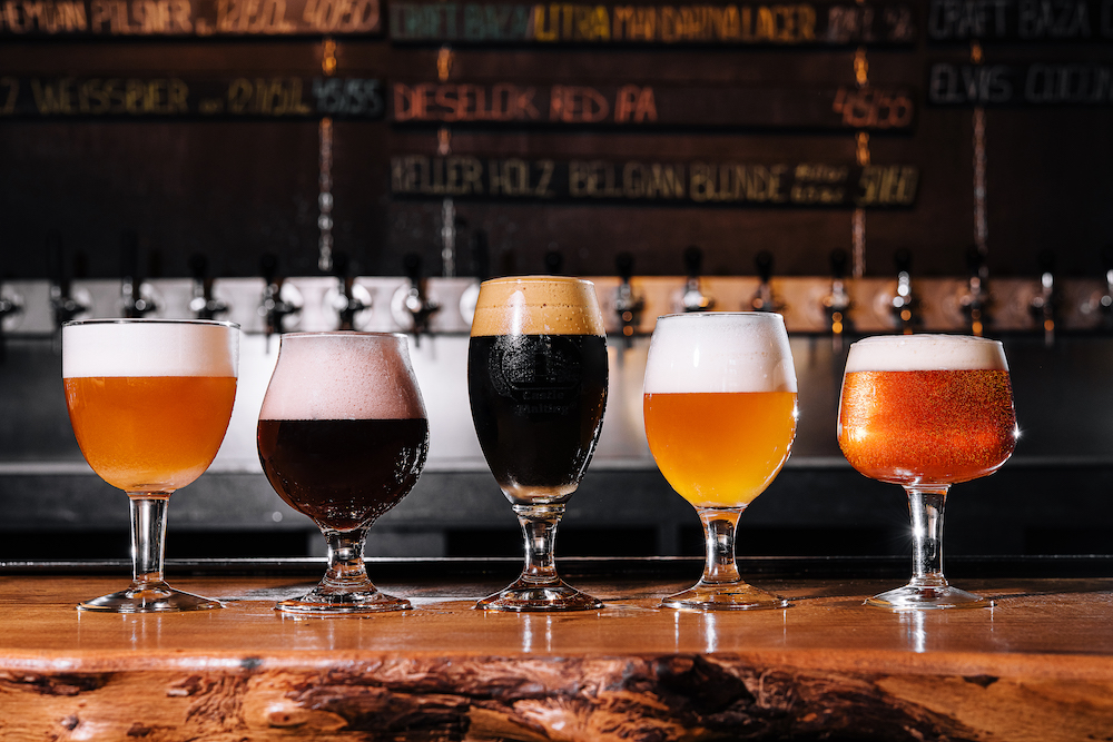 various craft beers lined up on a bar