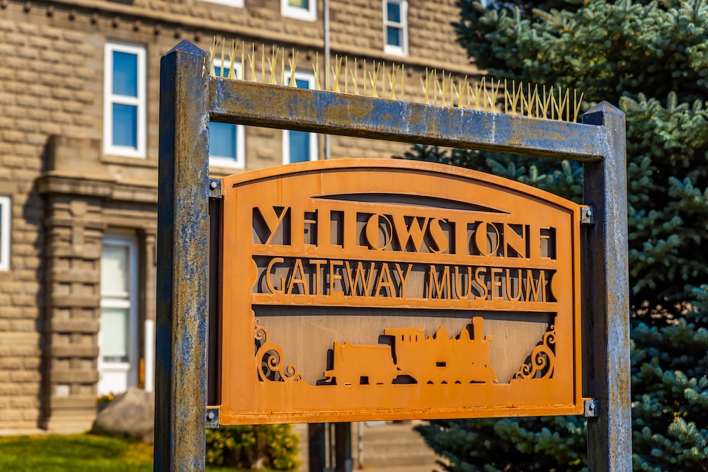 An orange sign that reads Yellowstone Gateway Museum at the Yellowstone Gateway Museum in Livingston, Montana